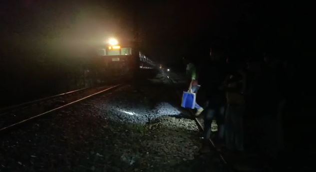 Two students were killed when a train hit them while they were playing a game on the railway line with headphones in their ears