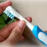 use an old toothbrush